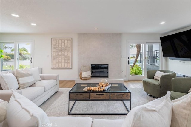 3802 E Summitridge Ln, Orange, CA 92867 - living room featuring a tiled fireplace, recessed lighting, and wood finished floors