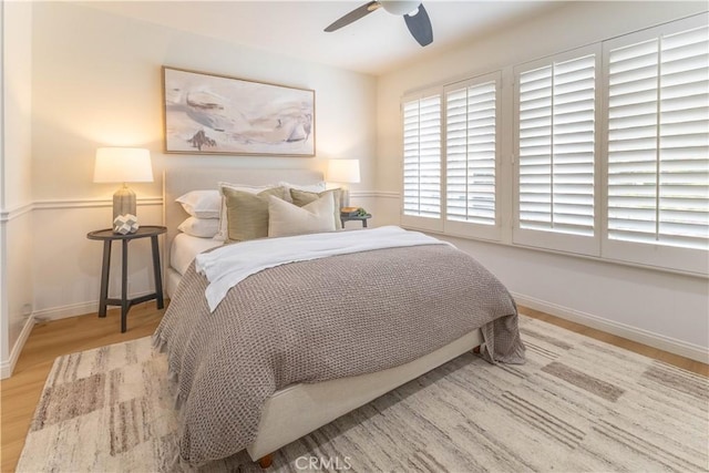 3802 E Summitridge Ln, Orange, CA 92867 - bedroom with baseboards, ceiling fan, and wood finished floors