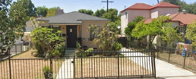 bungalow featuring fence, a chimney, a gate, and stucco siding