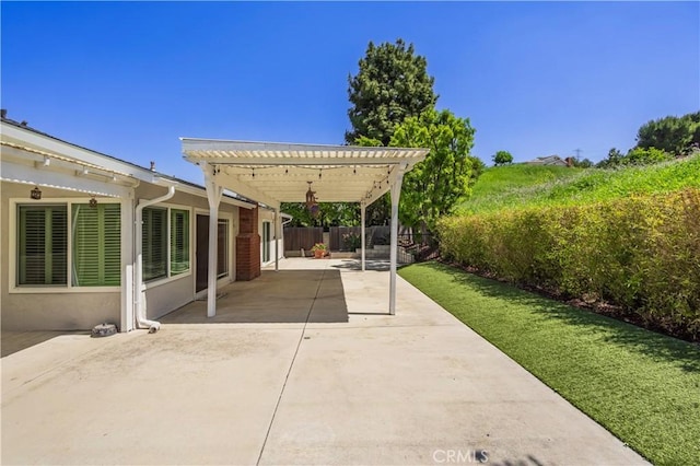view of patio / terrace with a fenced backyard and a pergola