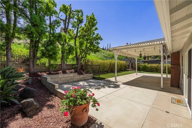 view of patio / terrace featuring a fenced backyard and a pergola