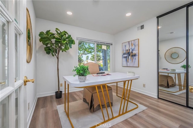 office area featuring baseboards, wood finished floors, visible vents, and recessed lighting