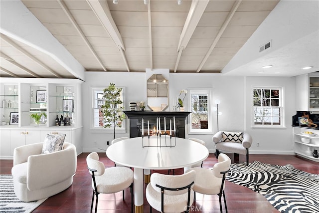 1056 Glenneyre St, Laguna Beach, CA 92651 - dining room with dark wood finished floors, visible vents, vaulted ceiling with beams, and baseboards