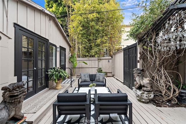 1056 Glenneyre St, Laguna Beach, CA 92651 - wooden deck with outdoor lounge area, fence, and french doors