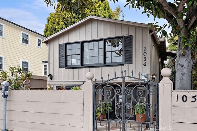 1056 Glenneyre St, Laguna Beach, CA 92651 - view of front of home featuring a gate, board and batten siding, and fence private yard