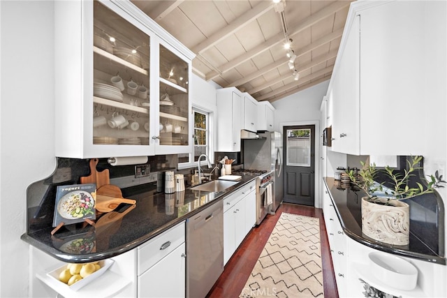 1056 Glenneyre St, Laguna Beach, CA 92651 - kitchen featuring a sink, dark wood finished floors, white cabinetry, lofted ceiling, and appliances with stainless steel finishes