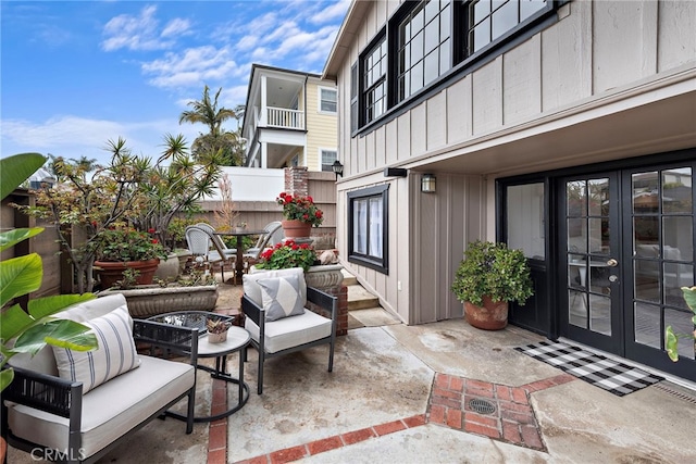 1056 Glenneyre St, Laguna Beach, CA 92651 - view of patio / terrace featuring french doors, fence, and an outdoor living space