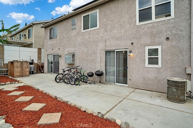 11568 Luanda St, Lakeview Terrace, CA 91342 - rear view of house featuring stucco siding, cooling unit, and a patio area