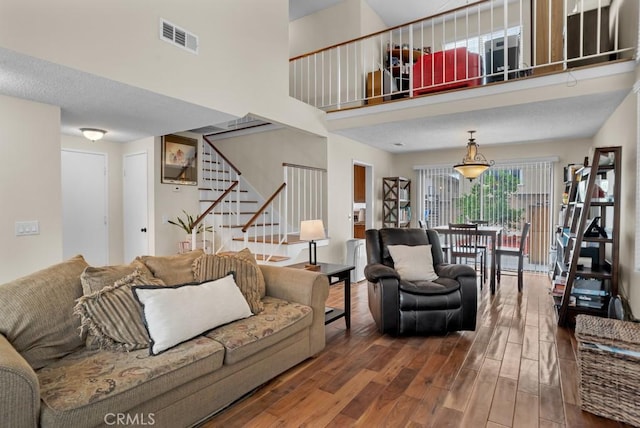 11568 Luanda St, Lakeview Terrace, CA 91342 - living area featuring stairway, wood finished floors, and a high ceiling