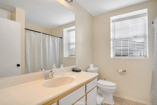 11568 Luanda St, Lakeview Terrace, CA 91342 - full bathroom featuring toilet, vanity, tile patterned flooring, and baseboards