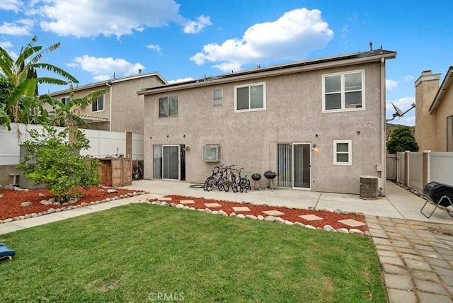 11568 Luanda St, Lakeview Terrace, CA 91342 - rear view of house with a patio, stucco siding, and solar panels