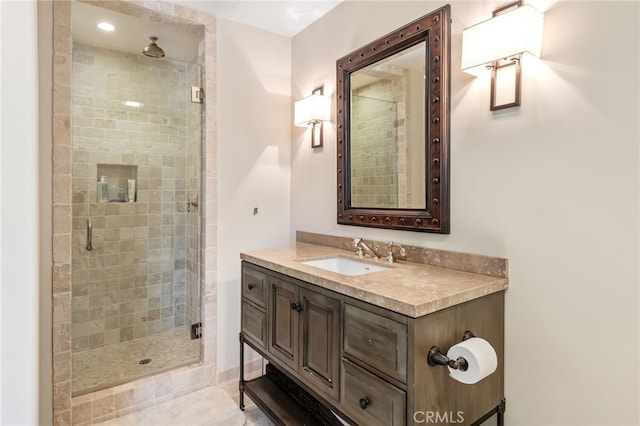 bathroom featuring vanity and a stall shower