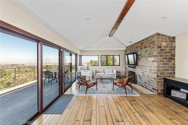 sunroom / solarium featuring beam ceiling