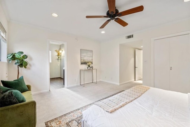 carpeted bedroom featuring baseboards, visible vents, recessed lighting, and ornamental molding