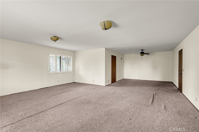 unfurnished room with carpet floors and ceiling fan