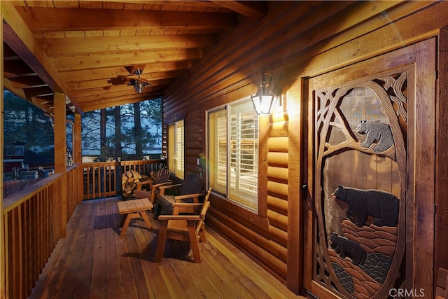 wooden terrace featuring ceiling fan