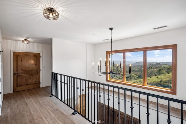 4385 Rainbow Vista Dr, Fallbrook, CA 92028 - hall with a chandelier, wood finished floors, and baseboards