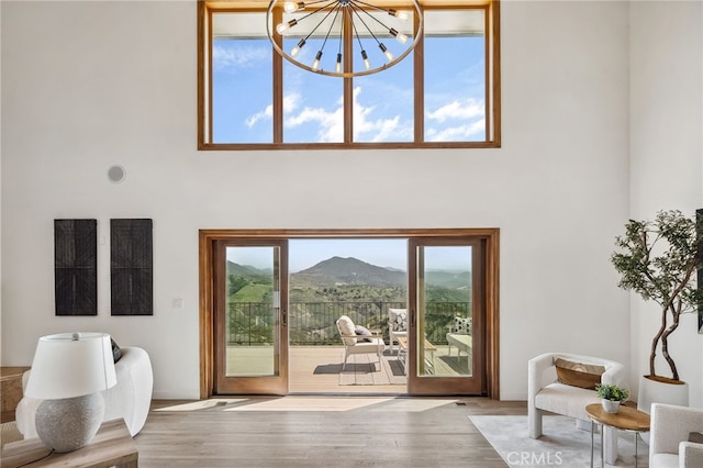 4385 Rainbow Vista Dr, Fallbrook, CA 92028 - entryway featuring a high ceiling, wood finished floors, a mountain view, and a chandelier