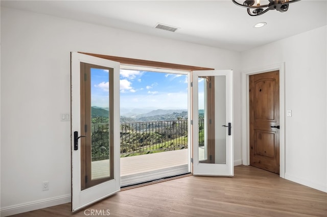4385 Rainbow Vista Dr, Fallbrook, CA 92028 - doorway to outside with a mountain view, a chandelier, wood finished floors, baseboards, and recessed lighting