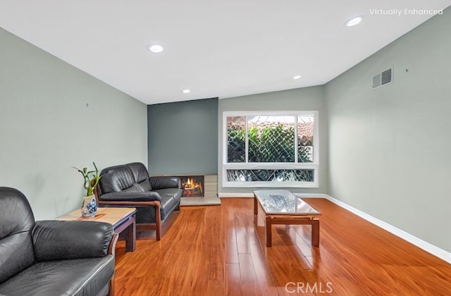 2530 Glenstone Ave, Hacienda Heights, CA 91745 - living room with wood finished floors, recessed lighting, baseboards, and vaulted ceiling