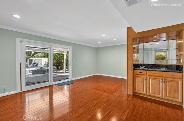 2530 Glenstone Ave, Hacienda Heights, CA 91745 - bar area featuring ornamental molding, wood finished floors, a sink, baseboards, and recessed lighting