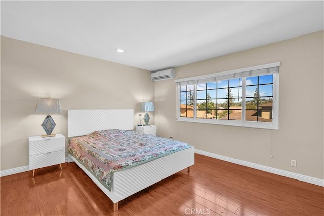 2530 Glenstone Ave, Hacienda Heights, CA 91745 - bedroom with baseboards, an AC wall unit, wood finished floors, and recessed lighting