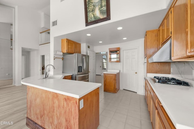 964 Vista Pointe Pl, Santa Paula, CA 93060 - kitchen with a sink, a towering ceiling, a peninsula, appliances with stainless steel finishes, and visible vents