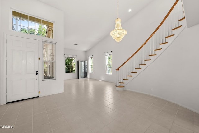 964 Vista Pointe Pl, Santa Paula, CA 93060 - entryway featuring high vaulted ceiling, stairway, an inviting chandelier, baseboards, and recessed lighting
