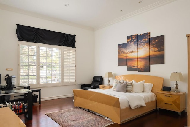 bedroom with wood finished floors, ornamental molding, baseboards, and multiple windows