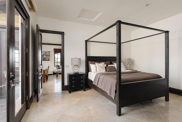 bedroom featuring baseboards