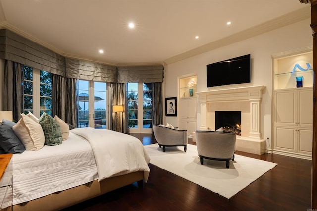 bedroom featuring wood finished floors, recessed lighting, ornamental molding, and access to exterior