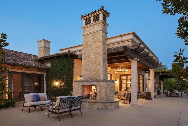 view of patio / terrace featuring an outdoor living space with a fireplace