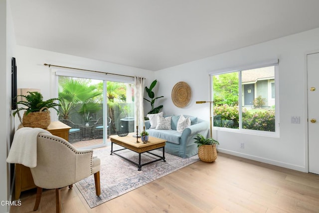 599 Rio Grande Cir, Thousand Oaks, CA 91360 - living room featuring light wood-type flooring, baseboards, and a healthy amount of sunlight