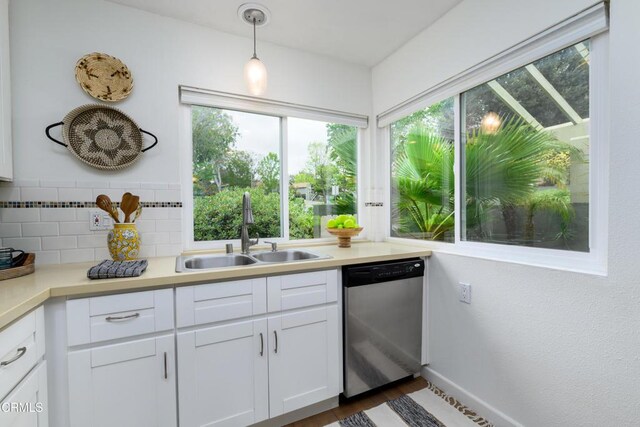 599 Rio Grande Cir, Thousand Oaks, CA 91360 - kitchen featuring a sink, white cabinets, dishwasher, and a wealth of natural light