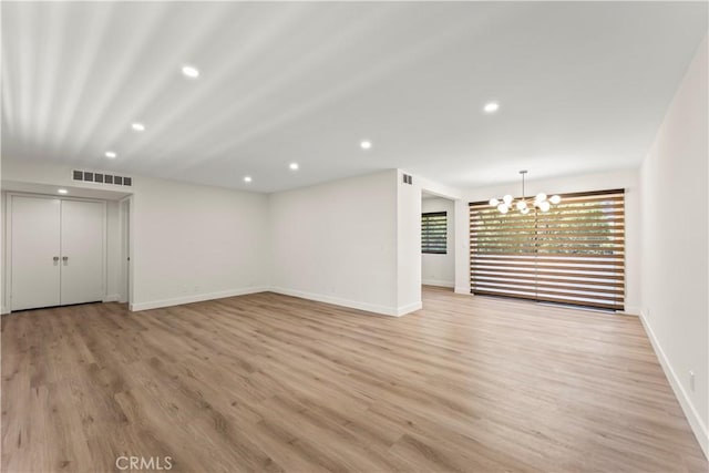 600 W Stocker St Unit 303, Glendale, CA 91202 - unfurnished living room with recessed lighting, a chandelier, baseboards, and light wood finished floors