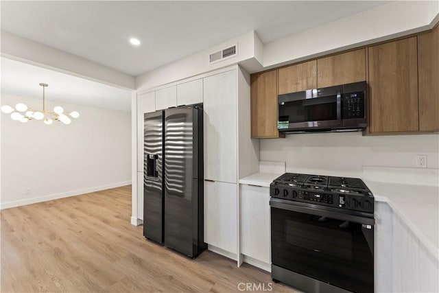 600 W Stocker St Unit 303, Glendale, CA 91202 - kitchen featuring stainless steel appliances, light countertops, light wood-type flooring, a chandelier, and brown cabinetry