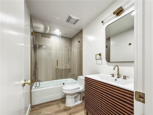 600 W Stocker St Unit 303, Glendale, CA 91202 - full bath featuring wood finished floors, vanity, toilet, and enclosed tub / shower combo