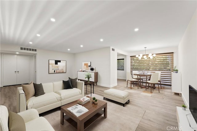600 W Stocker St Unit 303, Glendale, CA 91202 - living room with recessed lighting, a chandelier, light wood finished floors, and baseboards