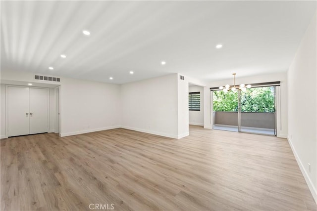 600 W Stocker St Unit 303, Glendale, CA 91202 - unfurnished living room featuring recessed lighting, a chandelier, baseboards, and light wood-style floors