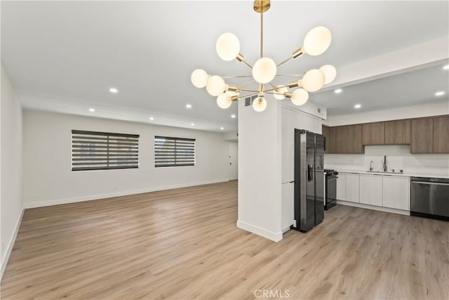 600 W Stocker St Unit 303, Glendale, CA 91202 - kitchen with stainless steel dishwasher, fridge with ice dispenser, a sink, light countertops, and recessed lighting