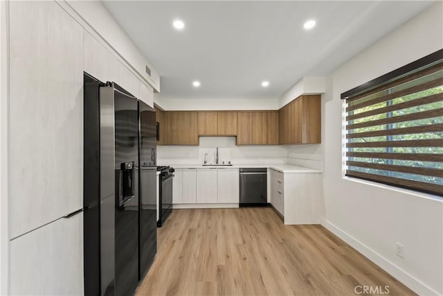 600 W Stocker St Unit 303, Glendale, CA 91202 - kitchen featuring dishwasher, fridge with ice dispenser, black range with gas cooktop, light countertops, and a sink