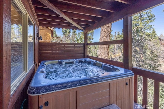 deck with a hot tub