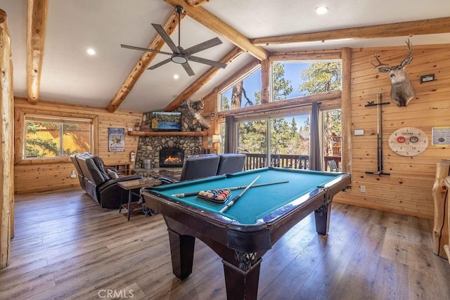 game room featuring hardwood / wood-style floors, wood walls, pool table, lofted ceiling with beams, and ceiling fan