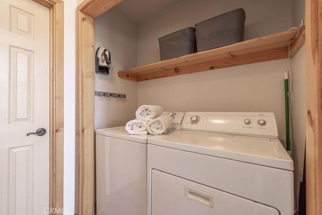 clothes washing area with washer and dryer and laundry area