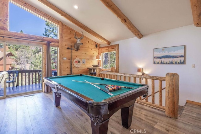 rec room with wood finished floors, beam ceiling, pool table, and wood walls