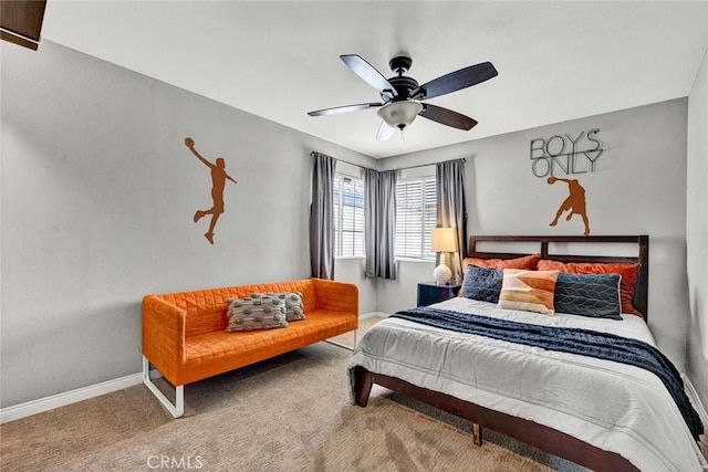 carpeted bedroom featuring a ceiling fan and baseboards
