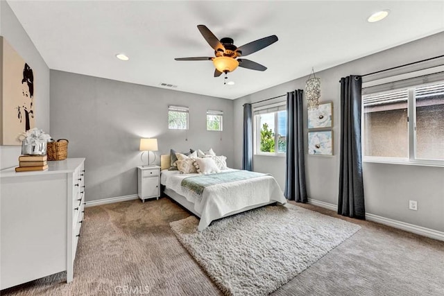 bedroom featuring ceiling fan, visible vents, baseboards, carpet flooring, and recessed lighting