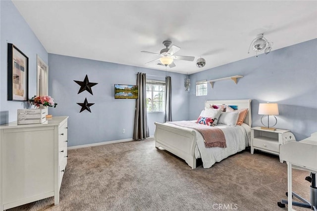 bedroom featuring baseboards, ceiling fan, and carpet flooring