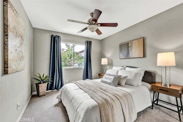 bedroom featuring baseboards, ceiling fan, and carpet floors