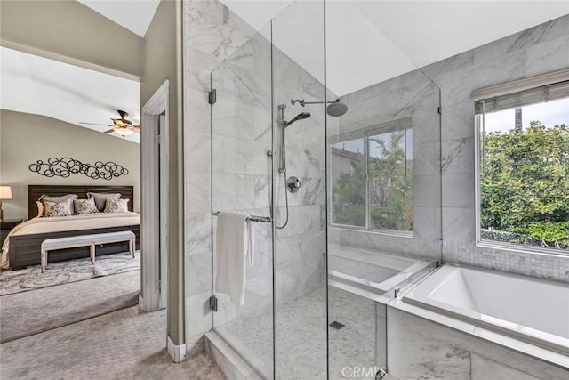 ensuite bathroom with ensuite bathroom, ceiling fan, a garden tub, and a shower stall